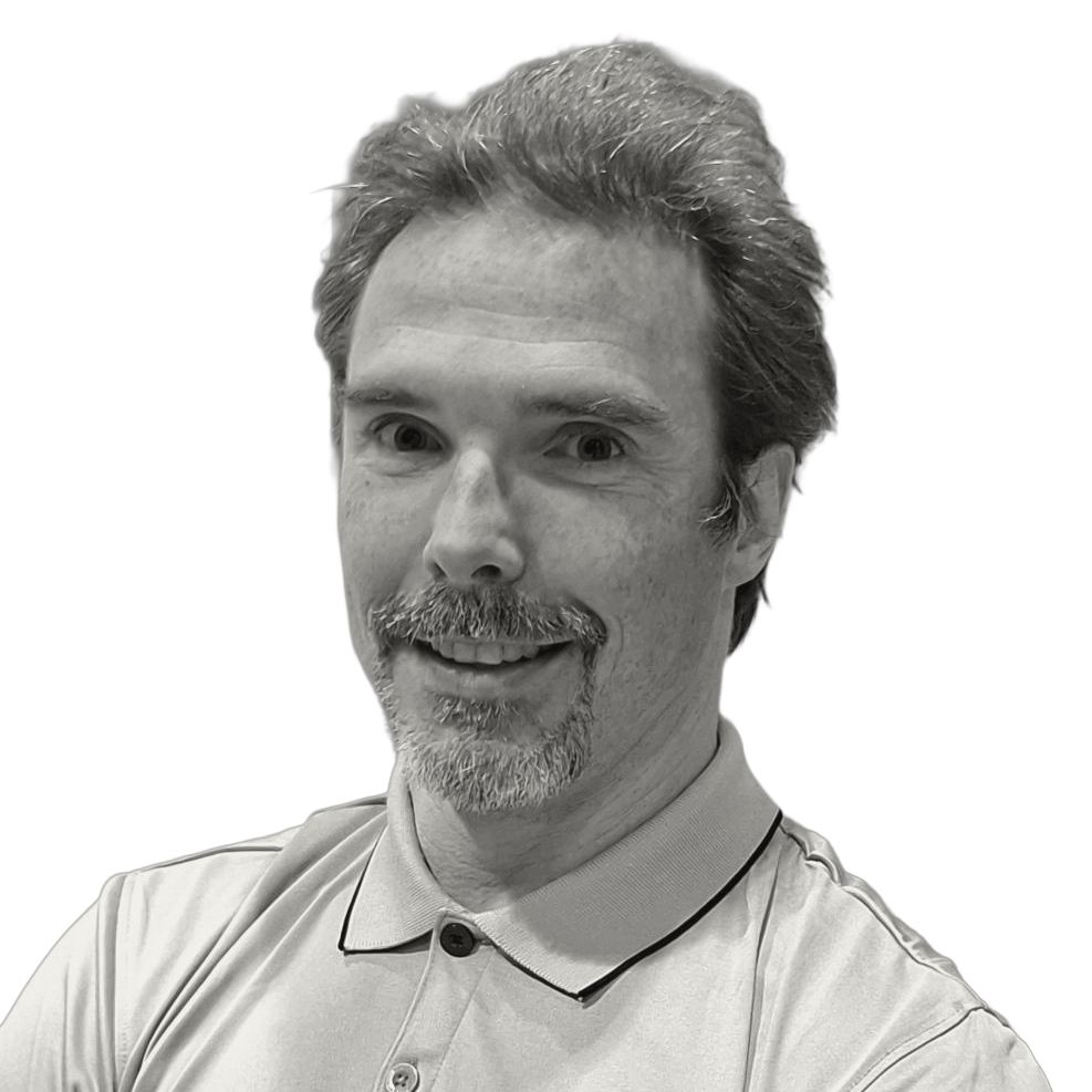 Headshot of a smiling person with a mustache and goatee, wearing a polo shirt, on a white background